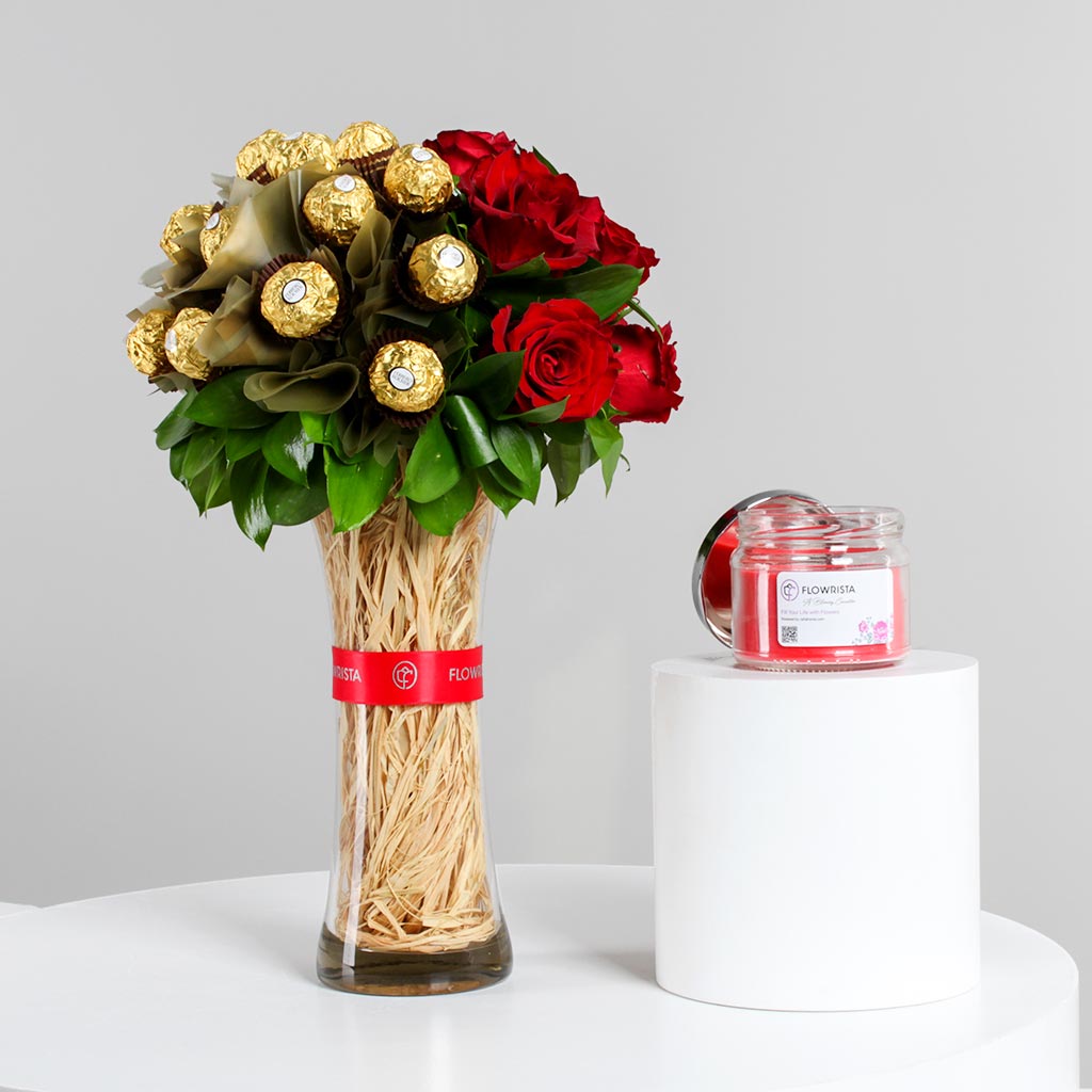 Flowrista Online Flowers Shop مزهرية ورود حمراء مع شوكولاتة فيريرو روشيه وشمعة زها هوم