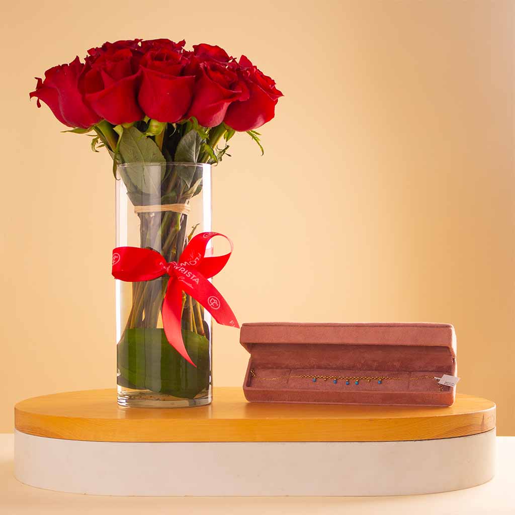 Flowrista Online Flowers Shop سوار سيران من الذهب عيار ١٨ قيراطًا مع مزهرية تضم ٢٠ وردة حمراء