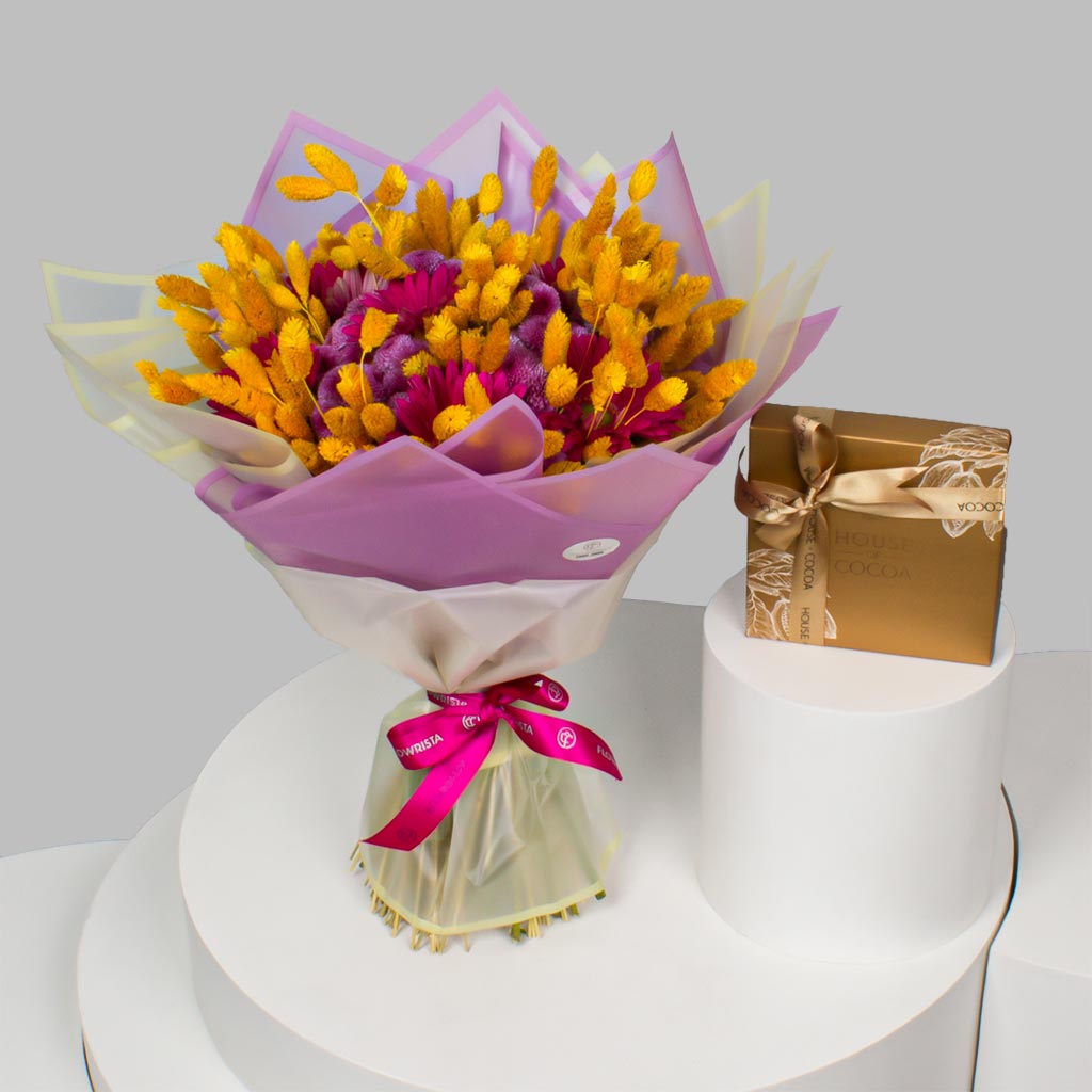 Flowrista Online Flowers Shop بوكس شوكولاتة هاوس أوف كاكاو 16 قطعة وزهور لولي بوب